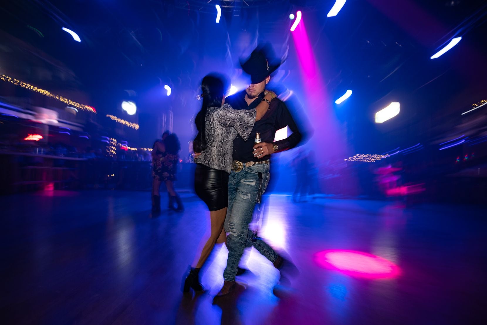 The couple dances on the dance floor at Rodeo West Dallas on Saturday night, January 7, 2023.