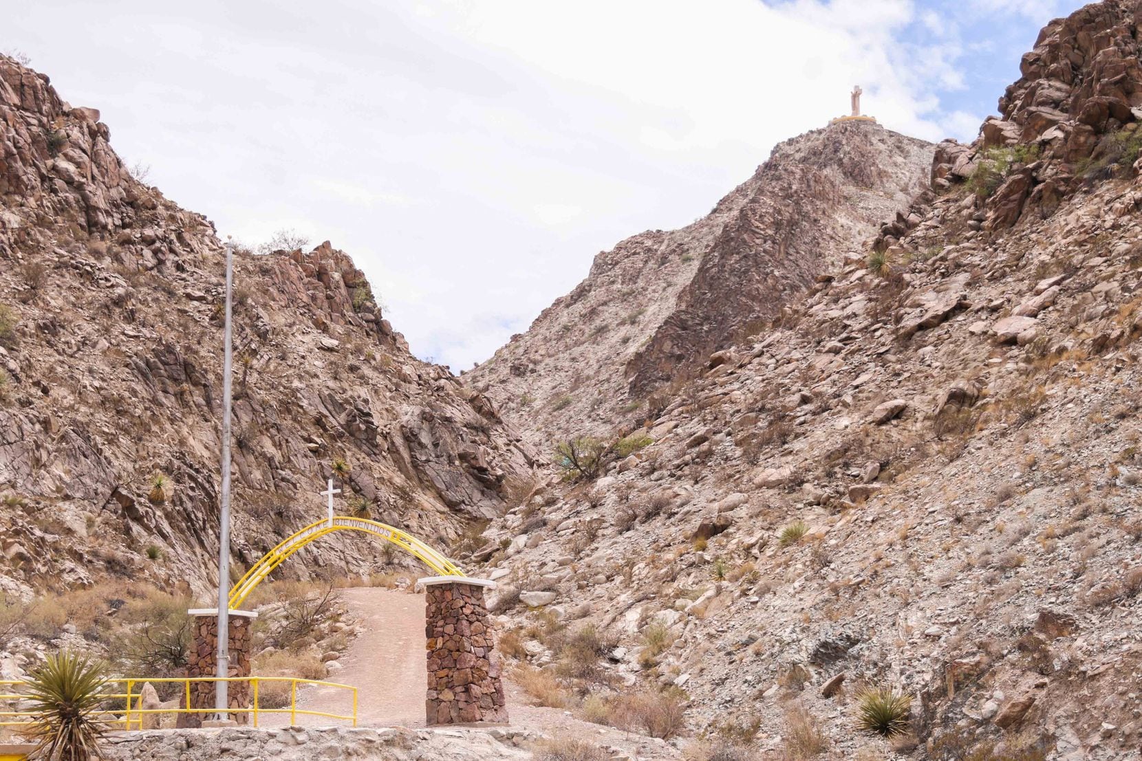 Many migrants crossing from Mexico into the U.S. near the Texas-New Mexico border pass by an enormous limestone Jesus on a cross atop Mount Cristo Rey.