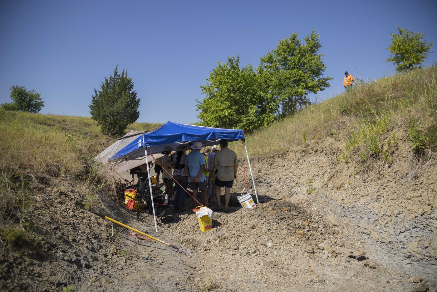 Paleontologists and crew from the Perot Museum of Nature and Science excavate part of a...