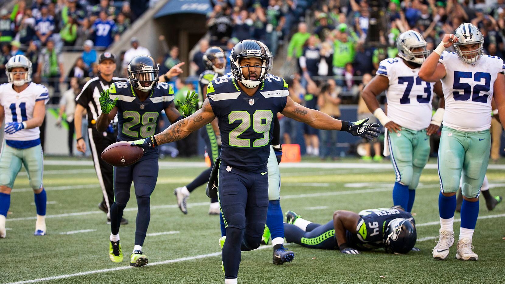 FILE — Earl Thomas taunts the Dallas Cowboys bench after intercepting a pass, Sept. 23,...