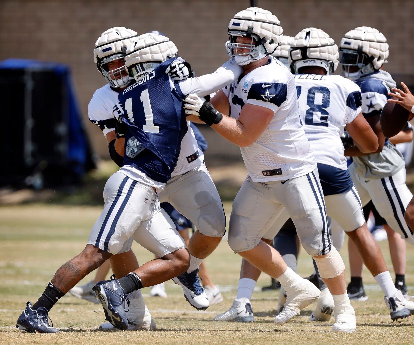 Dallas Cowboys outside linebacker Micah Parsons (11) is double teamed during training camp...