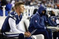 Dallas Cowboys place kicker Brandon Aubrey (17) sits on the bench after missing a field goal...