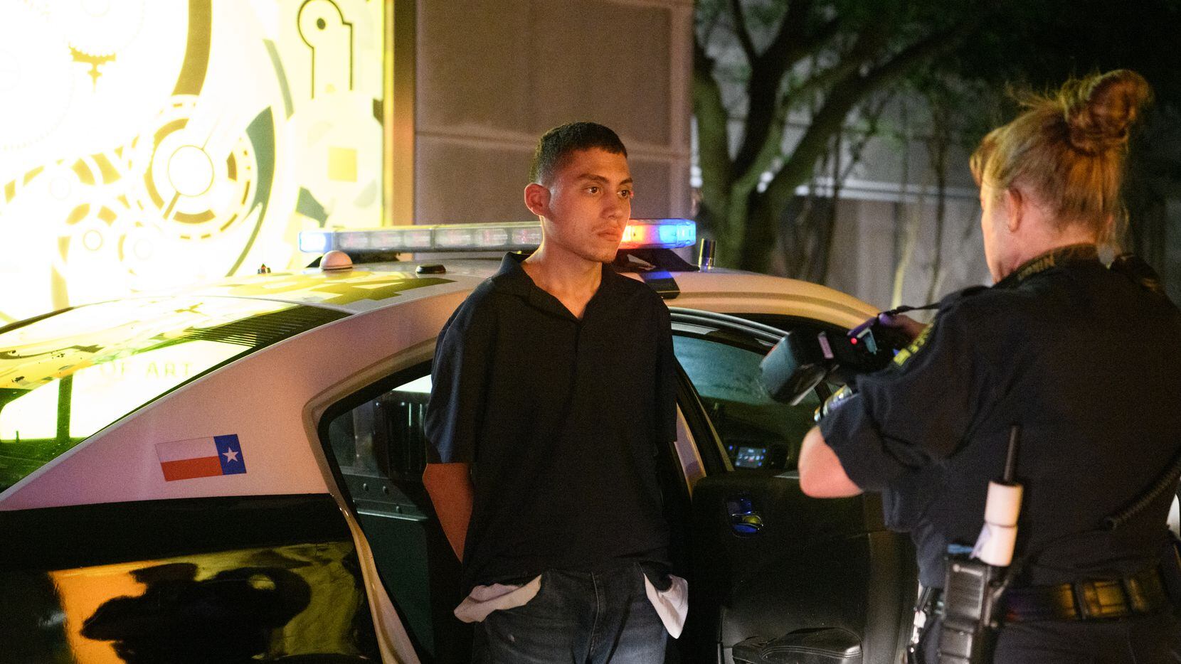 A Dallas Police crime scene analyst photographs Brian Hernandez, the alleged burglar,...