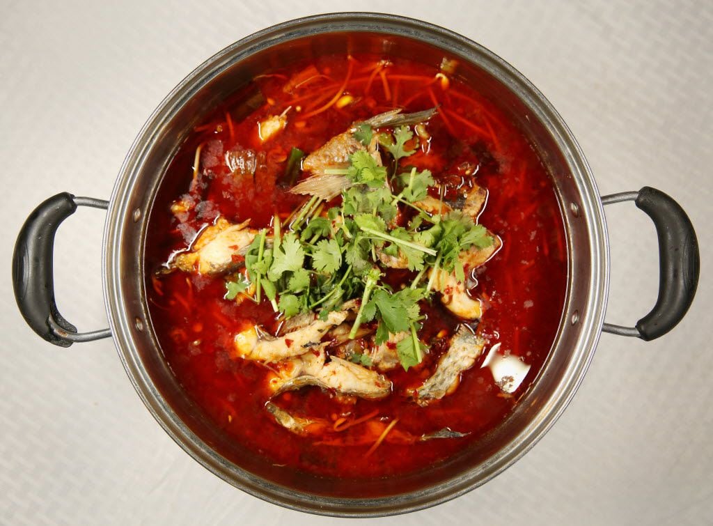 A fish hot pot is one of the "live fish" house specials that makes use of the tilapia that...