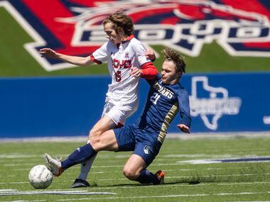 Keller’s Cade Whitmire (21) attempts to take the ball from McKinney Boyd’s Baily Helms (15)...