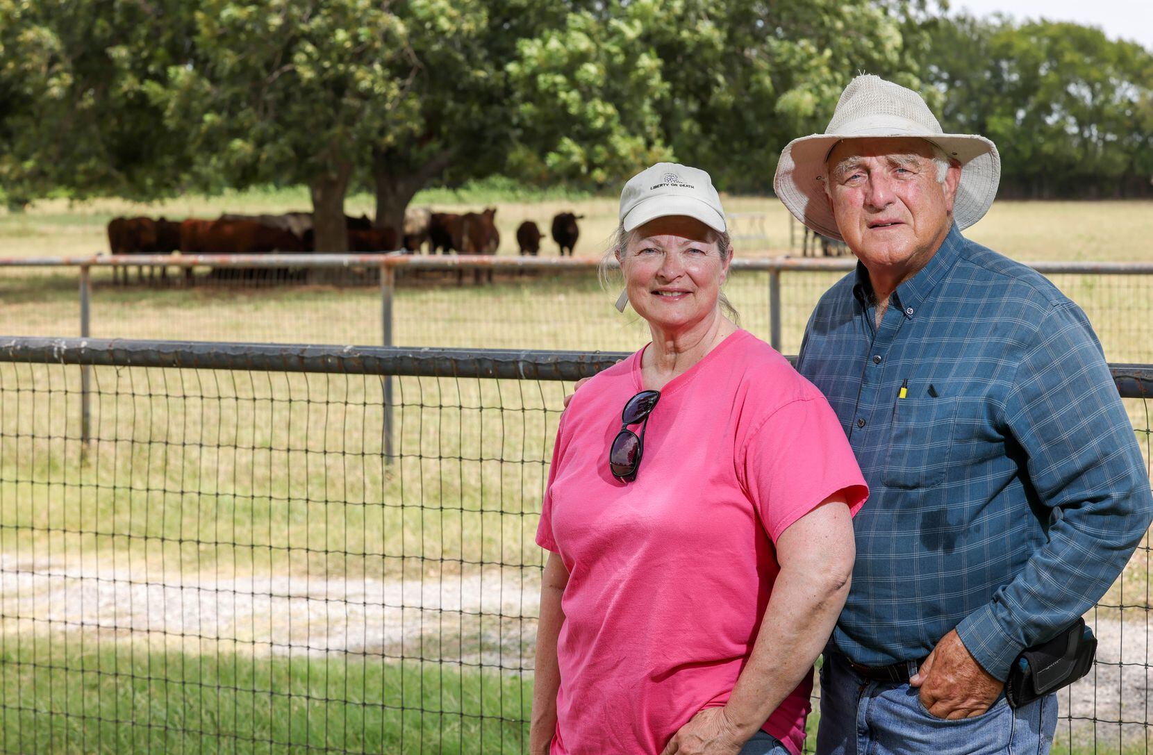 Karen (left) and David Thompson stand on their land in McKinney, where they live and care...