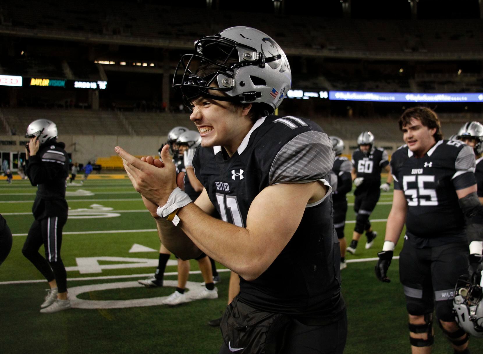 Denton Guyer quarterback Jackson Arnold (11) is unable to contain his excitement as he...