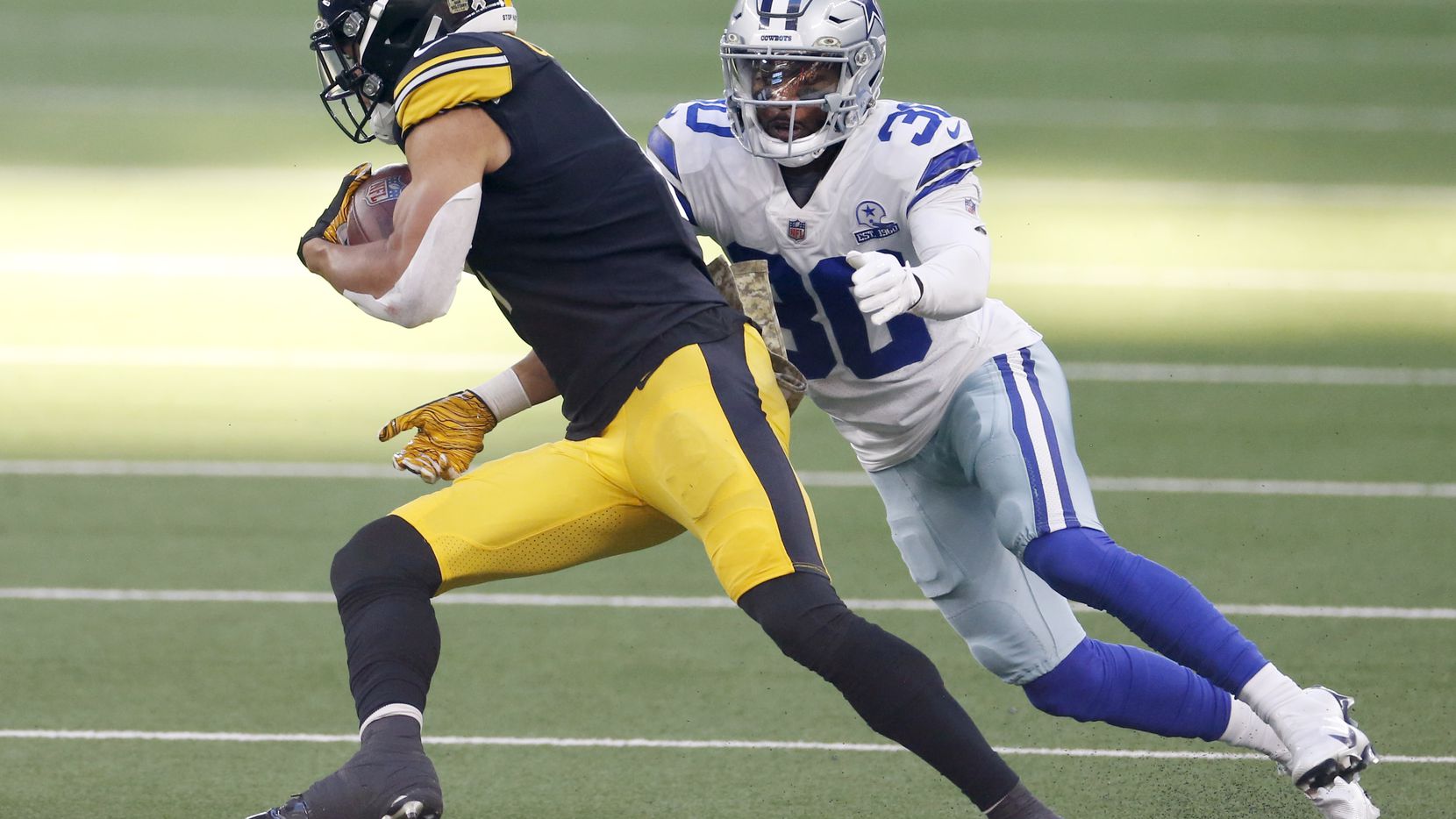 Dallas Cowboys cornerback Anthony Brown (30) prepares to tackle Pittsburgh Steelers wide receiver Chase Claypool (11) during the second quarter of play at AT&T Stadium in Arlington, Texas on Sunday, November 8, 2020.