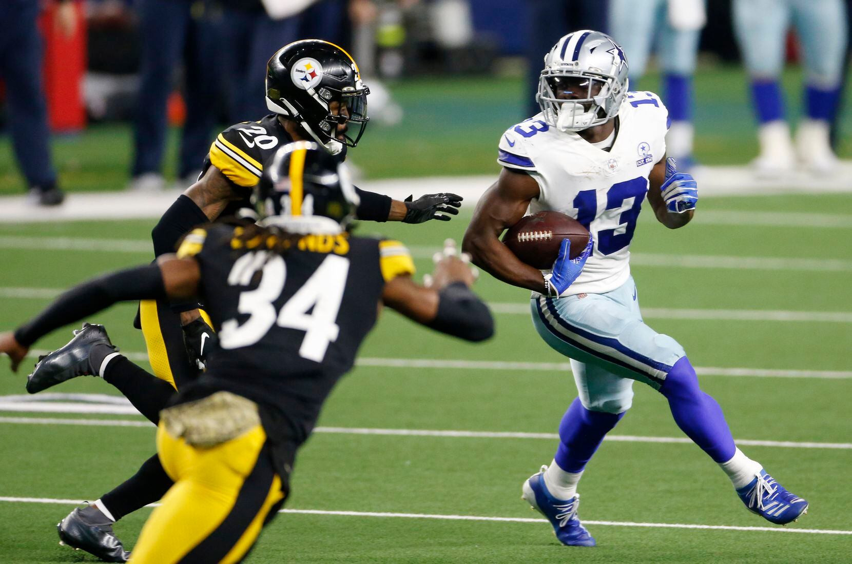 Dallas Cowboys wide receiver Michael Gallup (13) attempts to break away from Pittsburgh Steelers cornerback Cameron Sutton (20) after the catch during the fourth quarter of play at AT&T Stadium in Arlington, Texas on Sunday, November 8, 2020. Dallas Cowboys lost to the Pittsburgh Steelers 24-19. (Vernon Bryant/The Dallas Morning News)