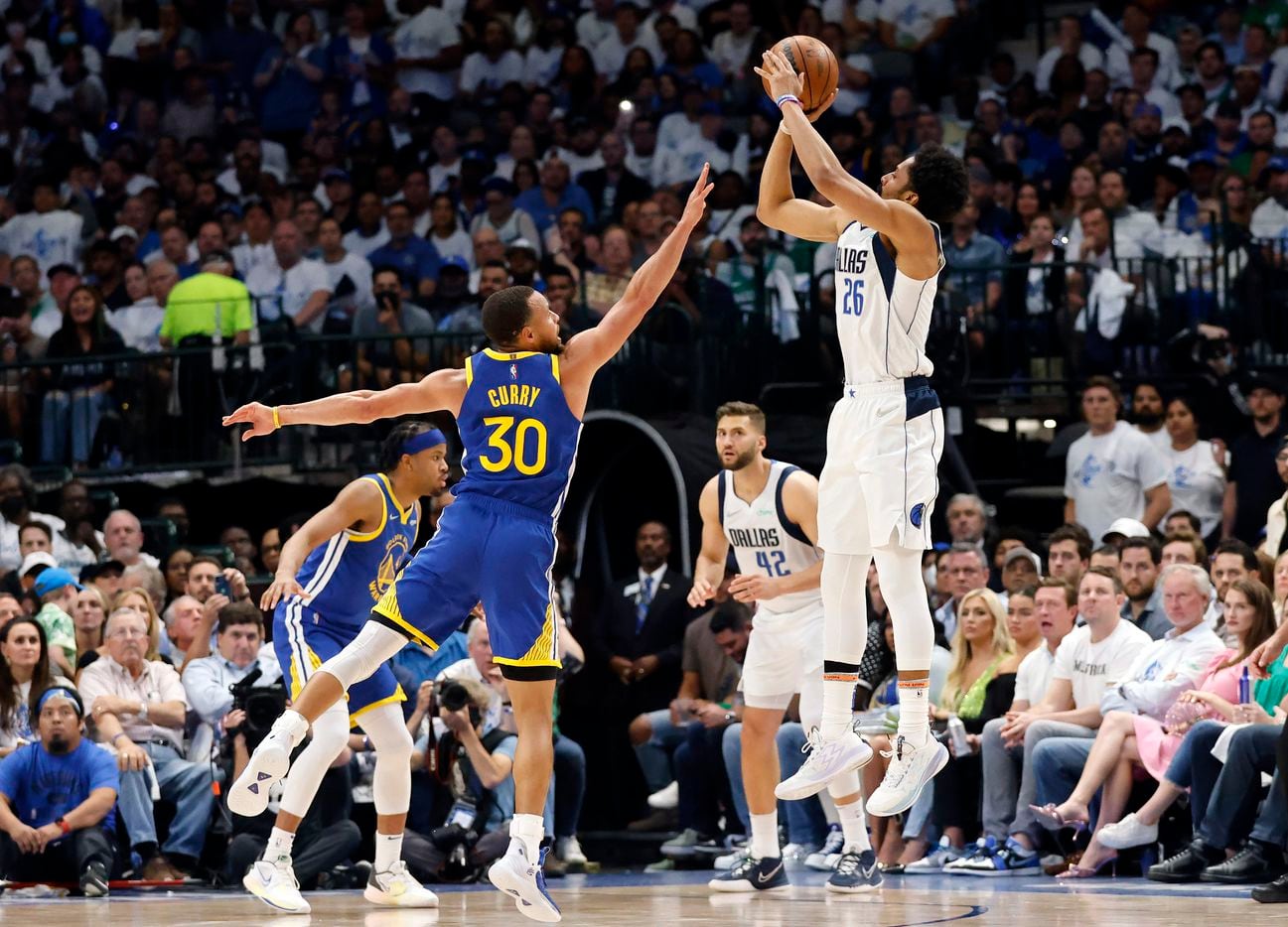 Dallas Mavericks guard Spencer Dinwiddie (26) puts up and makes a three-pointer against...