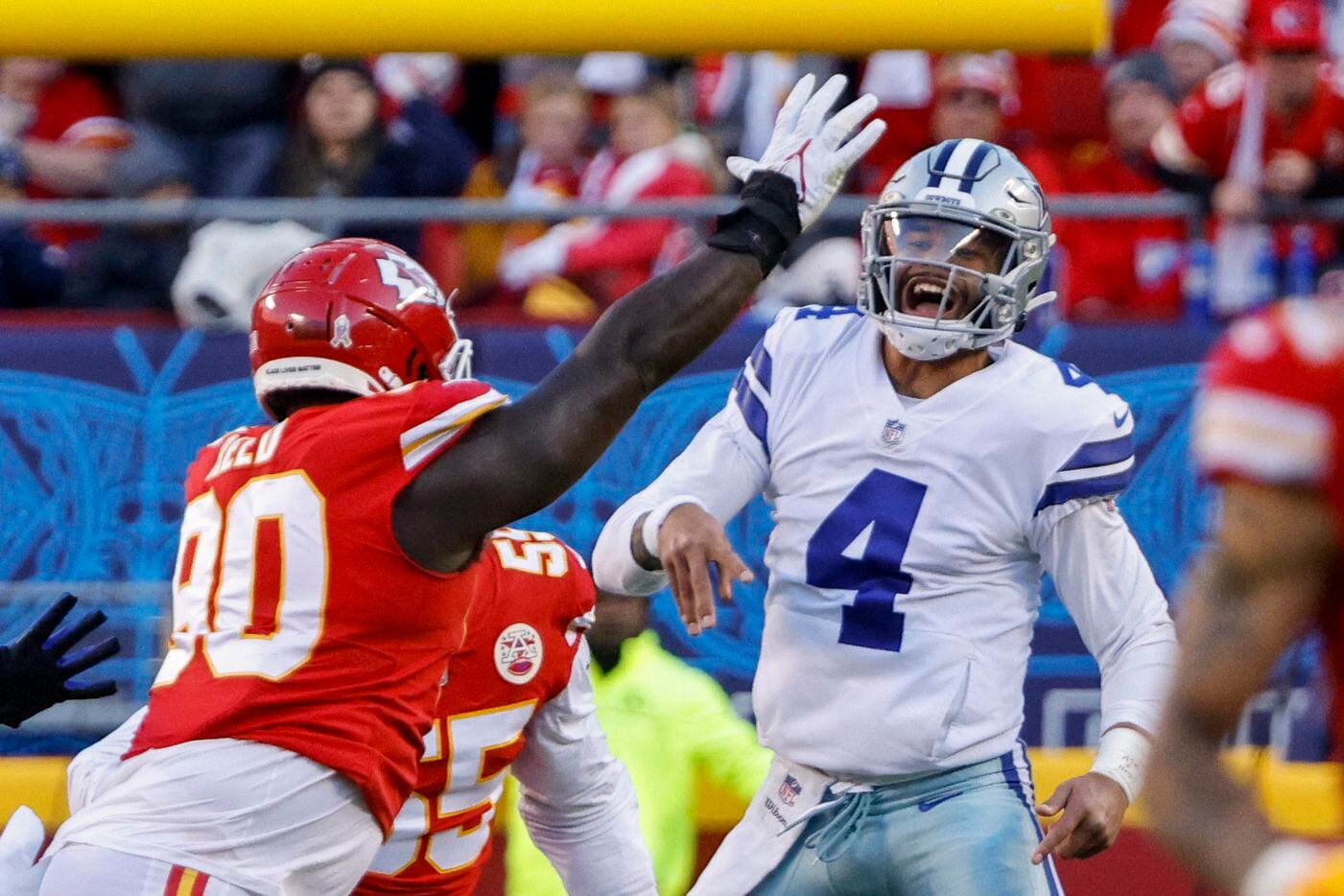 Dallas Cowboys quarterback Dak Prescott (4) reacts after throwing a pass under pressure from...