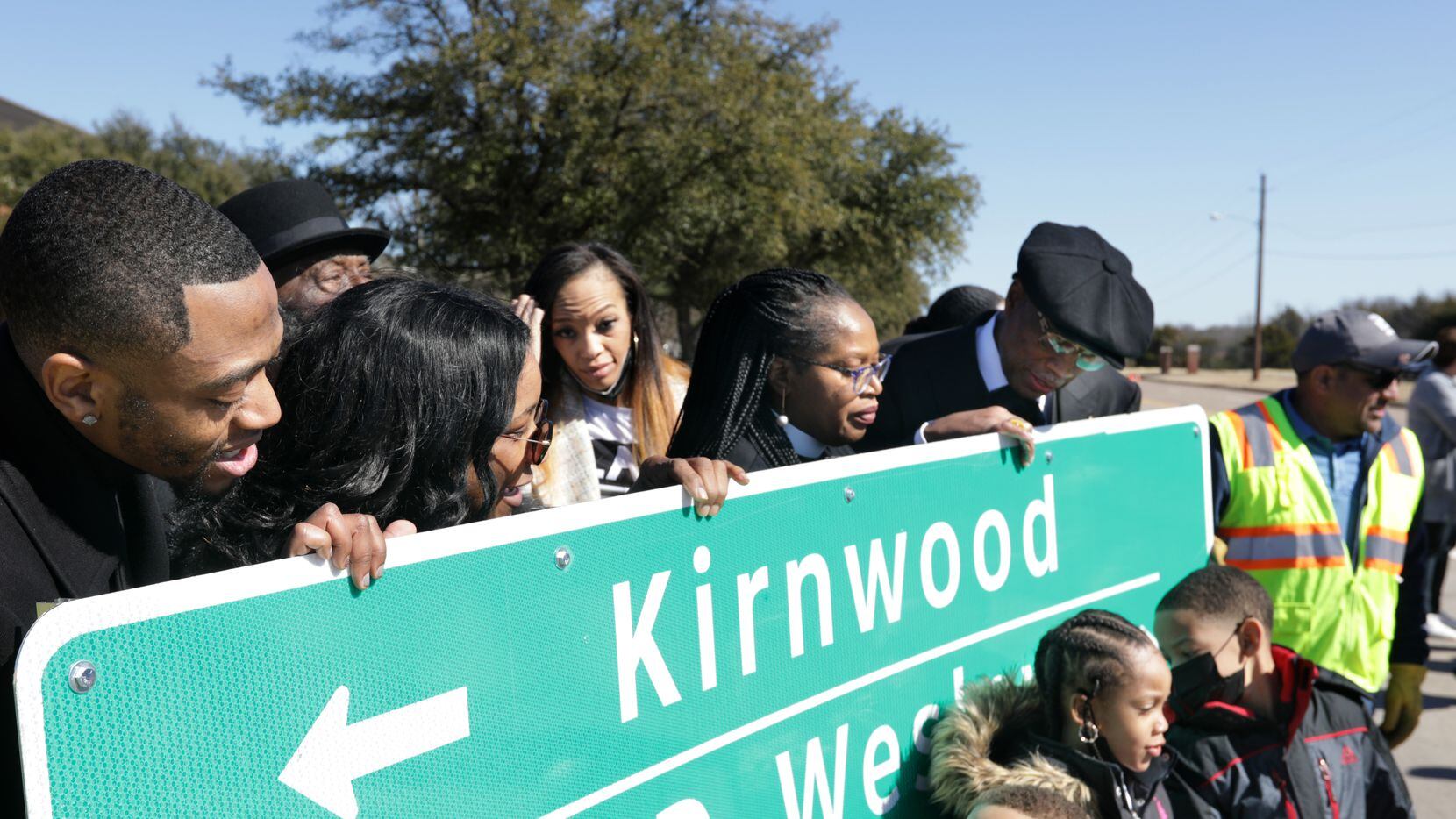 Community members celebrate the renaming of E. Kirnwood Dr. to Dr. KD Wesley Way during a...