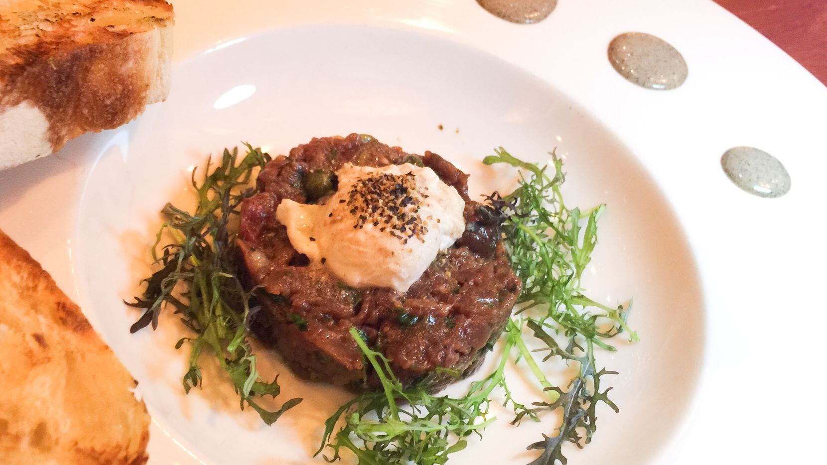 Chef Nick Amoriello's venison tartare at Kitchen LTO. Amoriello is in charge of the kitchen for a sixth-month stint chef at the "permanent pop-up" restaurant in Trinity Groves. Game meats such as antelope and rabbit are spotlighted on his menu. 