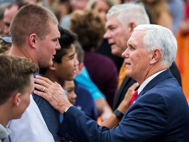 Vice President Mike Pence greets supporters after exiting Air Force Two with U.S....