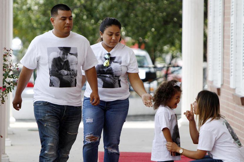 Las familiares y amigos de Raul “El Cinco” Bustamante” usaron camisetas blancas con un...