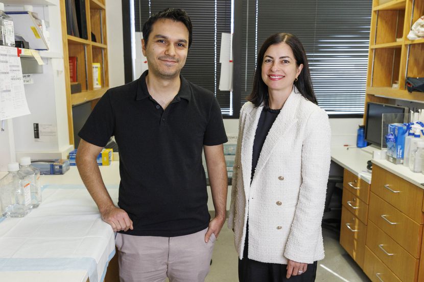 Graduate student Emre Caglayan (left) and lead scientist Genevieve Konopka stand in their...