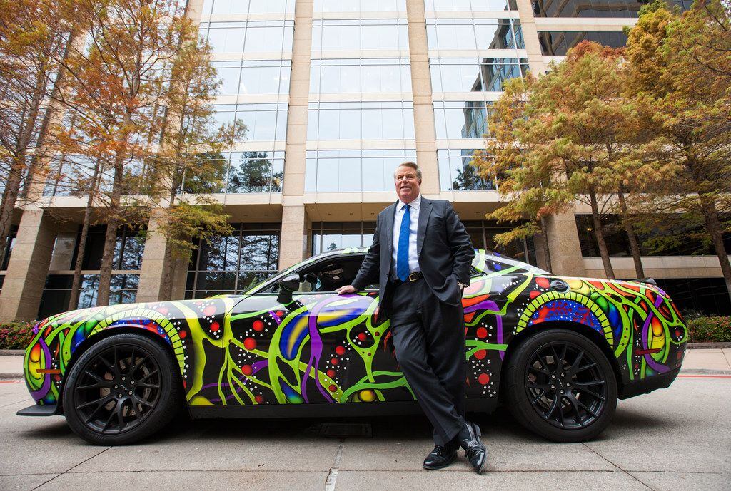 Chairman and CEO Clifford Fischer poses for a portrait next to his custom wrapped 2015 Dodge...