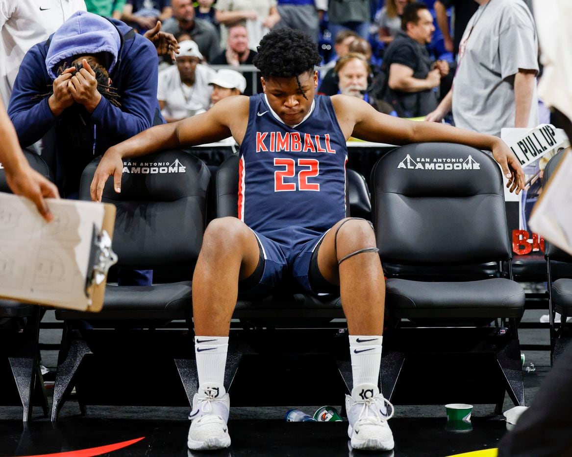 Kimball forward Andre Kanu (22) sits on the bench after a Class 5A state semifinal game loss...