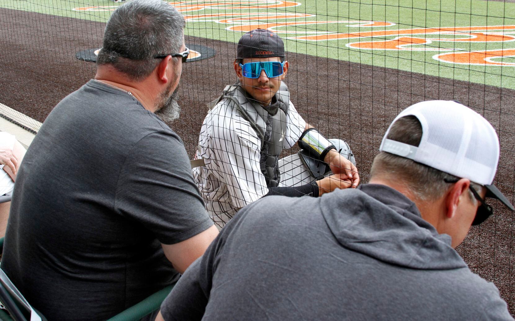 Rockwell catcher Daniel Ramirez (21) chats with Yellow Jackets supporters prior to the start...