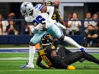 Dallas Cowboys cornerback DaRon Bland (26) intercepts a pass intended for Washington...