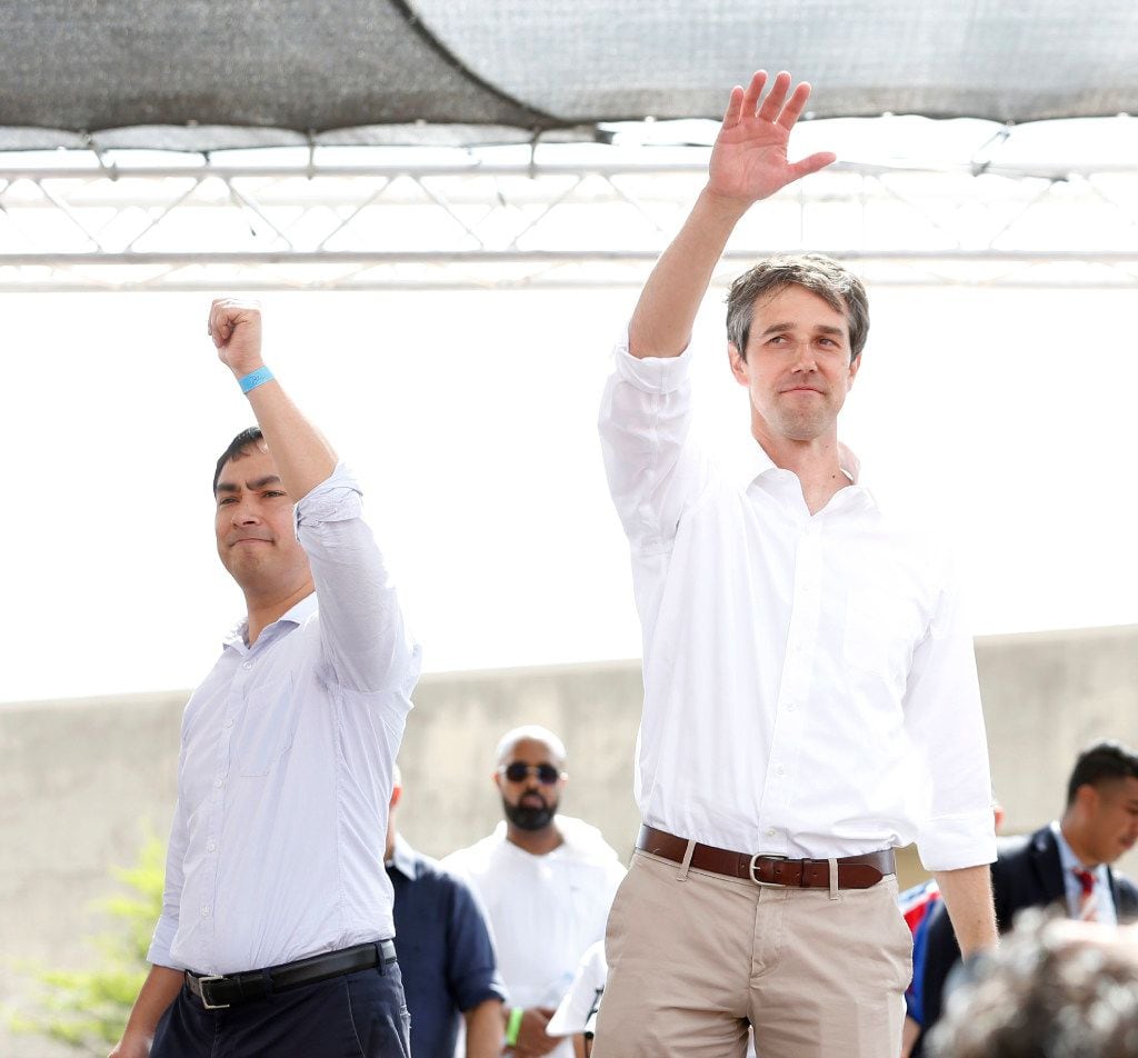 Reps. Joaquin Castro and Beto O'Rourke wave to the crowd during Mega March in front of...
