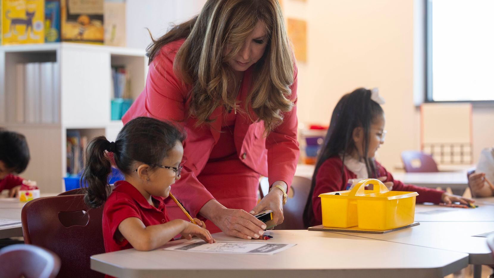 Dallas ISD superintendent Stephanie S. Elizalde gives first-grade student Laya Sweeny some...