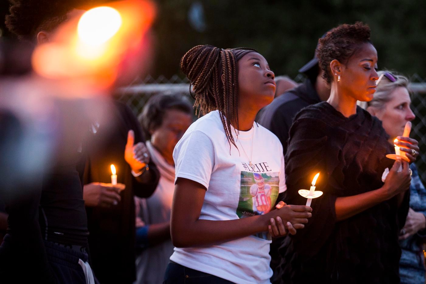 Ashuntae Coleman, 14, stands with her mother Demetria Brown (right) attend the "Remember His...