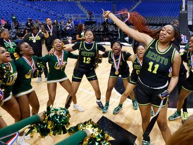 DeSoto forward Tionna Herron (11) dances with her team after winning the Class 6A state...