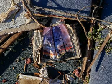 A bible is seen amongst the rubble at Primera Iglesia Bautista Mexicana church just off of...