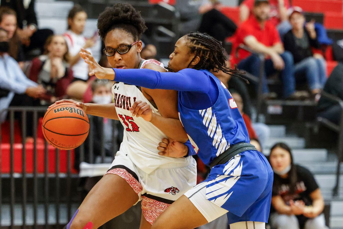 Braswell’s Alisa Williams, left, goes past Allen’s Heaven Amaechi during a district 5-6A...