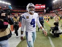 Dallas Cowboys quarterback Dak Prescott (4) walks off the field following their loss to the...