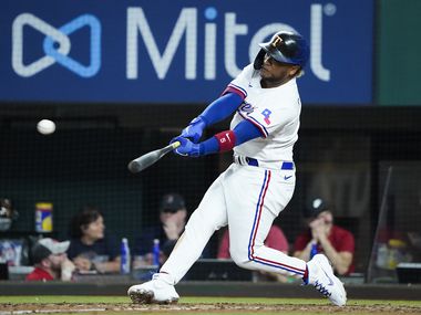 Texas Rangers designated hitter Willie Calhoun connects for a double during the eighth inning against the Boston Red Sox at Globe Life Field on Saturday, May 1, 2021.