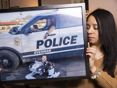 Annette Arango has a family photo of father Alex Arango, an officer with Everman ...