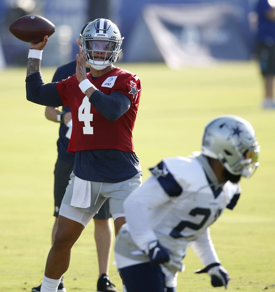 Dallas Cowboys quarterback Dak Prescott (4) looks to pass to Dallas Cowboys running back...