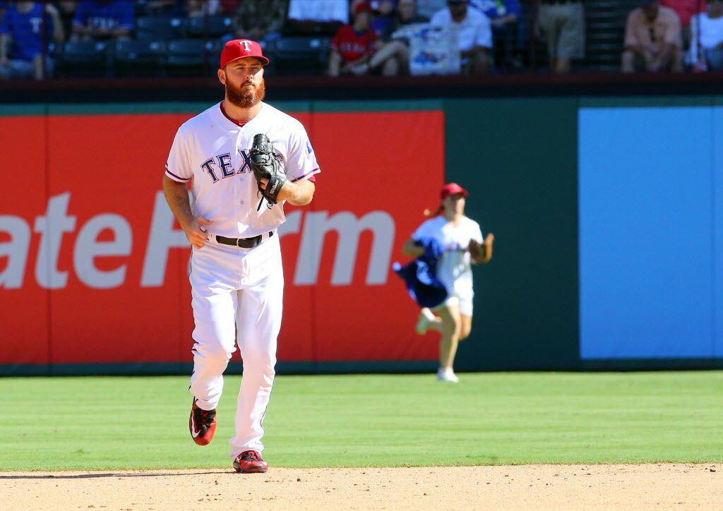 ARLINGTON, TX - AUGUST 28: Sam Dyson #47 of the Texas Rangers runs from the bullpen to take...