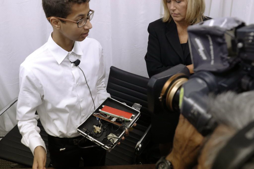 "Clock Boy" Ahmed Mohamed shows the clock he built in a school pencil box after a news...