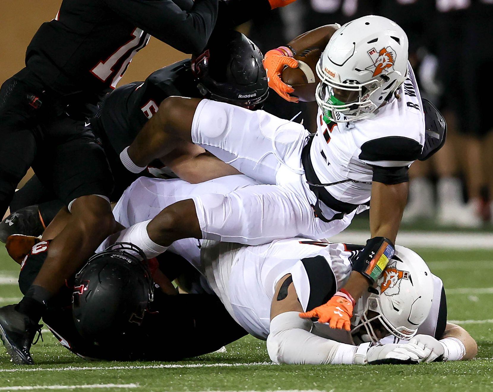 Aledo running back Ryan Williams rolls over his lineman for a first down against Frisco...