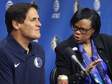February 26, 2018: Dallas Mavericks CEO Cynthia Marshall advises owner Mark Cuban on an answer during a press conference at American Airlines Center in Dallas. Marshall was hired by the Mavericks to help clean up the organization after a sexual harassment scandal in the front office.
