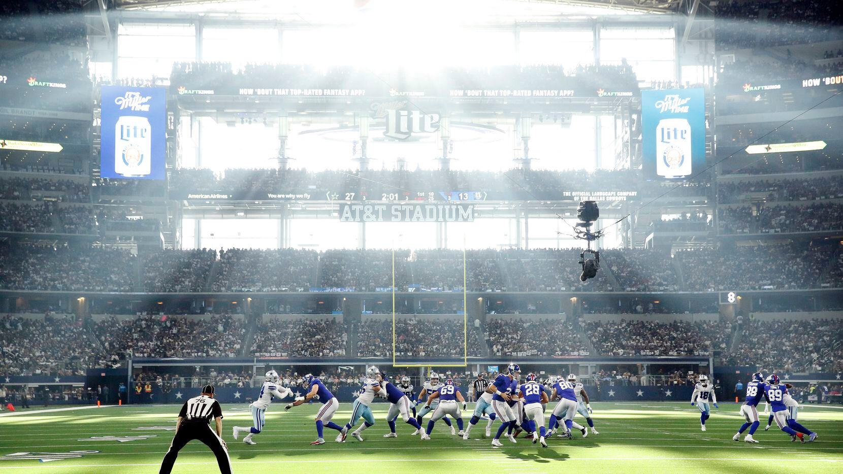 As the sun streams through the west retractable doors, New York Giants quarterback Mike...