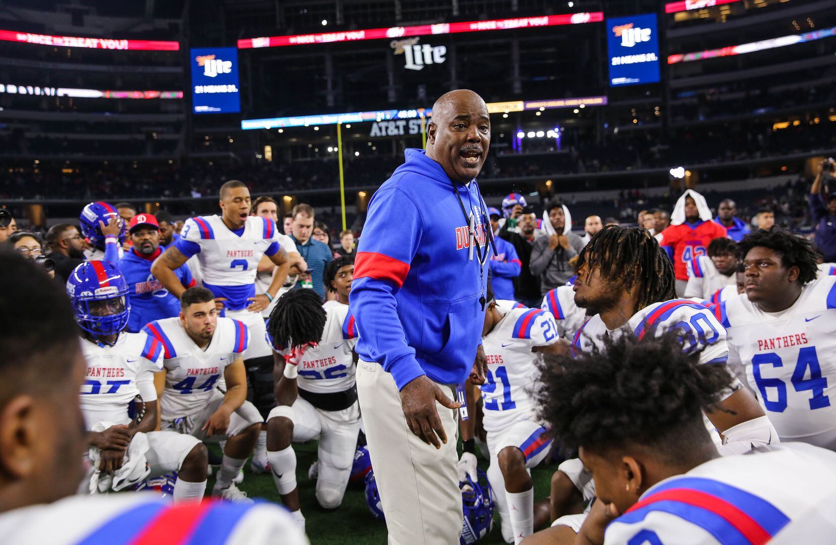 Duncanville's coach Reginald Samples consoles speaks to his team after losing a Class 6A...