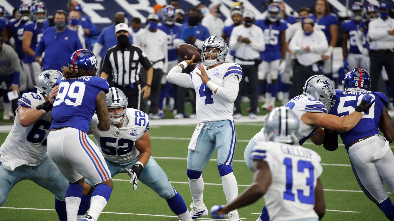 FILE - Cowboys quarterback Dak Prescott (4) throws a pass toward the end zone during the...
