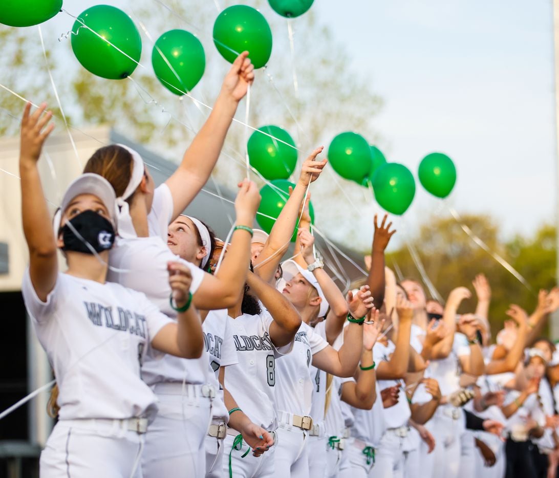 Denton Guyer players release balloons in honor of Dylan Dorrell before a game against Keller in Denton on Tuesday, March 30, 2021. Dorrell, a student at Denton Guyer, died from a sudden cardiac arrest after his cross-country practice in August last year. (Juan Figueroa/ The Dallas Morning News)
