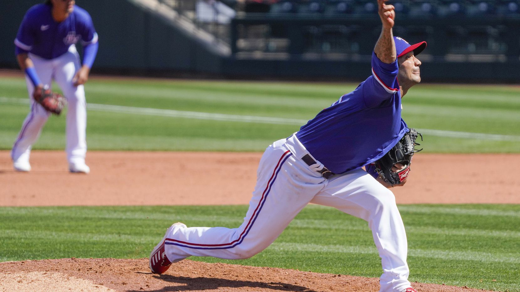 Texas Rangers pitcher Matt Bush delivers during the fourth inning of a spring training game...