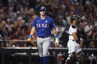 Texas Rangers’ Josh Jung reacts after striking out during the fifth inning in Game 3 of the...