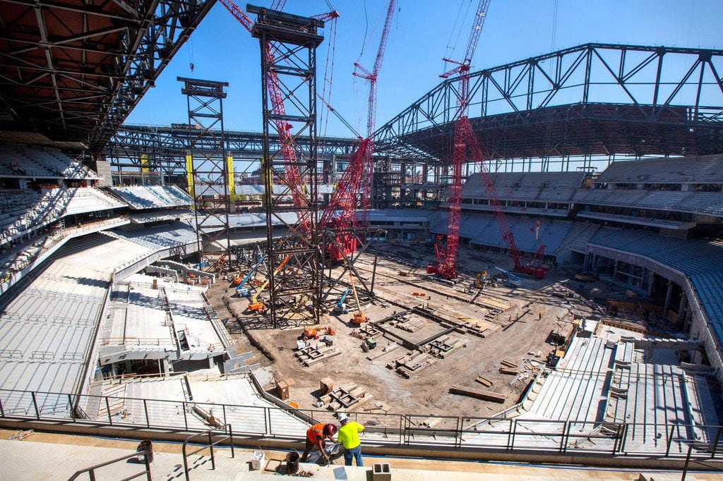 Construction personnel work at the Globe Life Field stadium in Arlington, Texas, on Friday,...