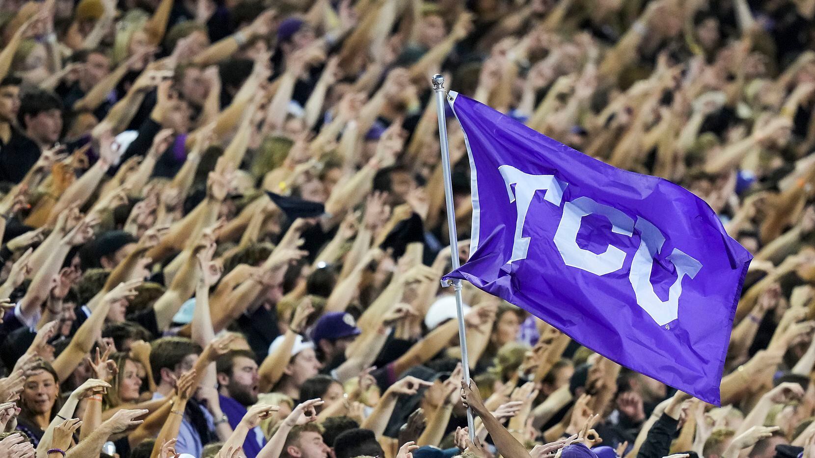 TCU fans cheer their team during the first half an NCAA football game against TCU on...