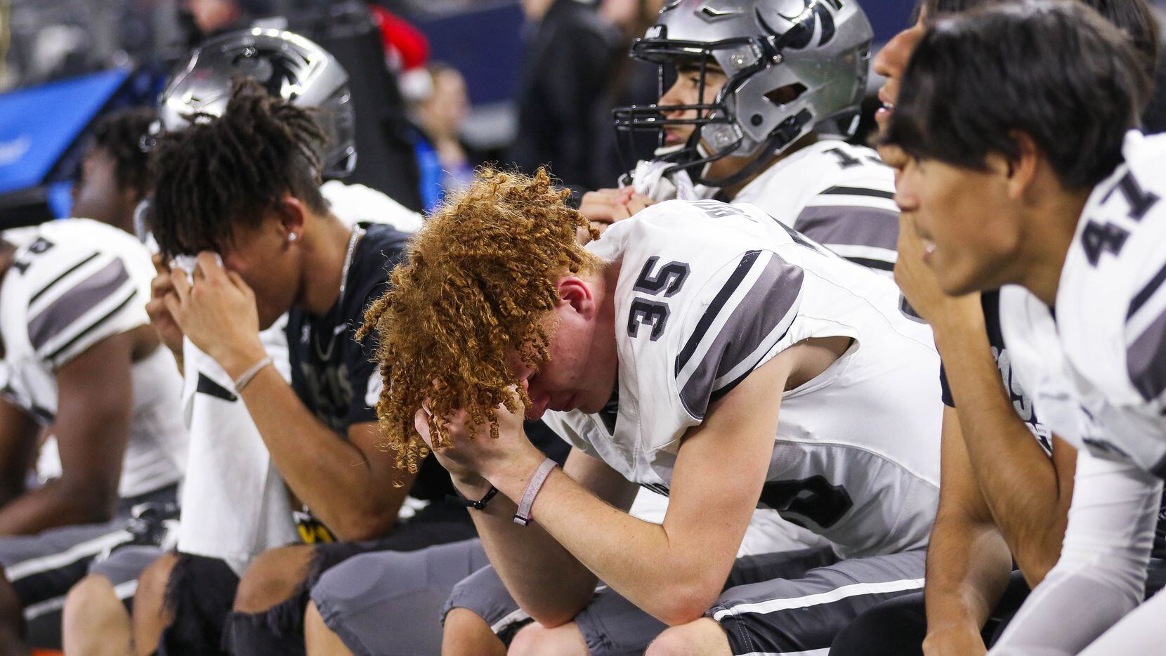 Denton Guyer players watch the fourth quarter of a Class 6A Division II state championship...