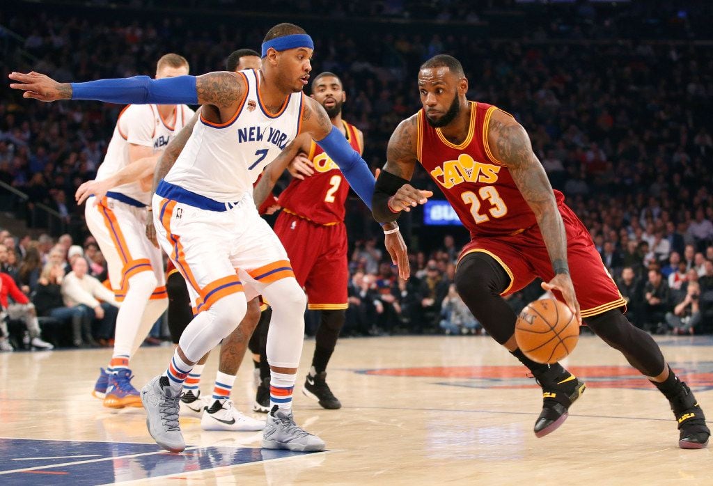 Cleveland Cavaliers forward LeBron James (23) drives to the basket with New York Knicks...