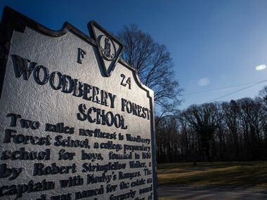 A historical marker stands at the entrance to Woodberry Forest School, an all-boys private...