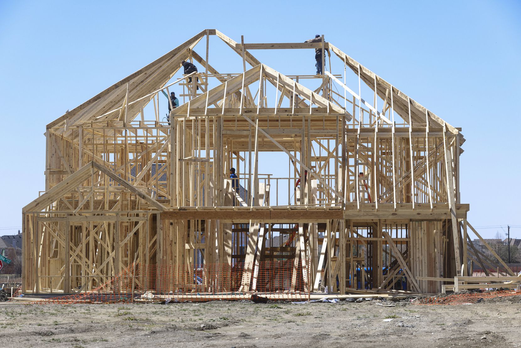 The frame of a new home is shown in Frisco.  Tanya O'Neil, a Realtor who works in growing...